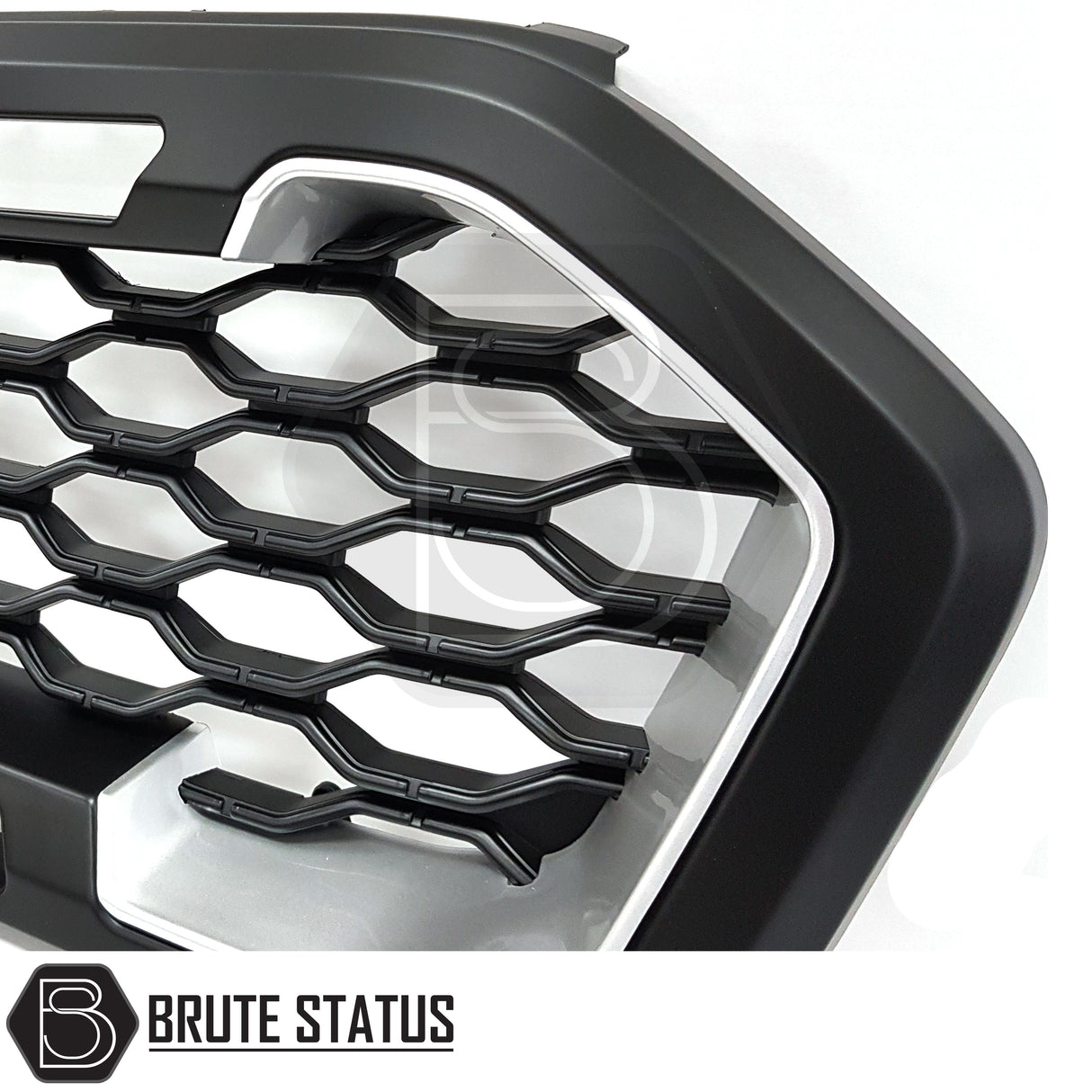 Raptor-style black and silver grille for Ford Ranger T8 (2019-2022) non-Wildtrak models, ABS plastic, enhances front-end appearance, reversible fit using original mounting points.