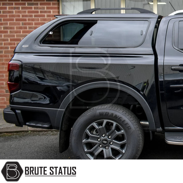 Rear-side view of a black Ford Ranger 2023+ T9 with Truckman GLS Hardtop Canopy, featuring remote locking and lockable sliding windows for enhanced ventilation and security.