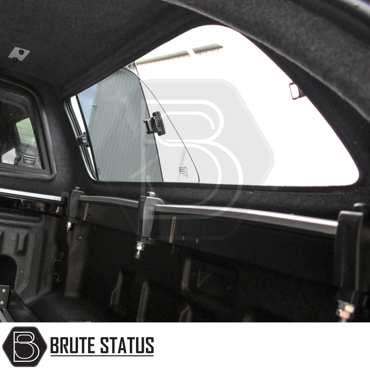 Ford Ranger 2023+ T9 Truckman GLS Hardtop Canopy with lockable sliding windows and Brute Status cargo-mount rail inside the truck bed, enhancing utility and security.