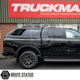 Ford Ranger 2023+ T9 Truckman GLS Hardtop Canopy with remote locking, featuring tinted, lockable sliding windows and a sporty design, parked in front of a building.