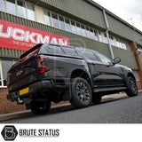 Ford Ranger 2023+ T9 Truckman GLS Hardtop Canopy with remote locking, featuring tinted and lockable sliding windows, parked before an industrial building.