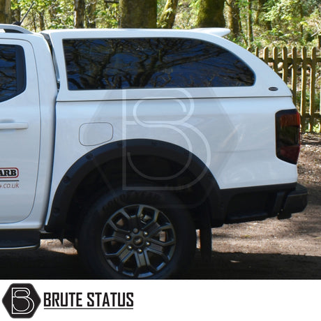 Ford Ranger 2023+ T9 Truckman Grand Hardtop Canopy with tinted windows, alloy wheel, and BRUTE STATUS logo, showcasing premium design and remote locking.