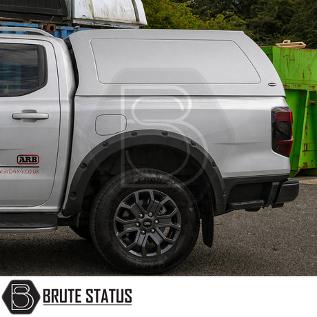 Heavy duty hardtop canopy fitted to Ford Ranger 2023+ Moondust Silver pickup truck 4x4 offroad vehicle. Suitable for secure overlanding set ups. 
