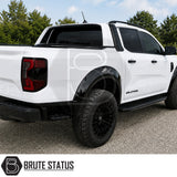 Ford Ranger 2023+ Double Cab in white featuring gloss black rivet style wheel arch extensions with aggressive off-road styling