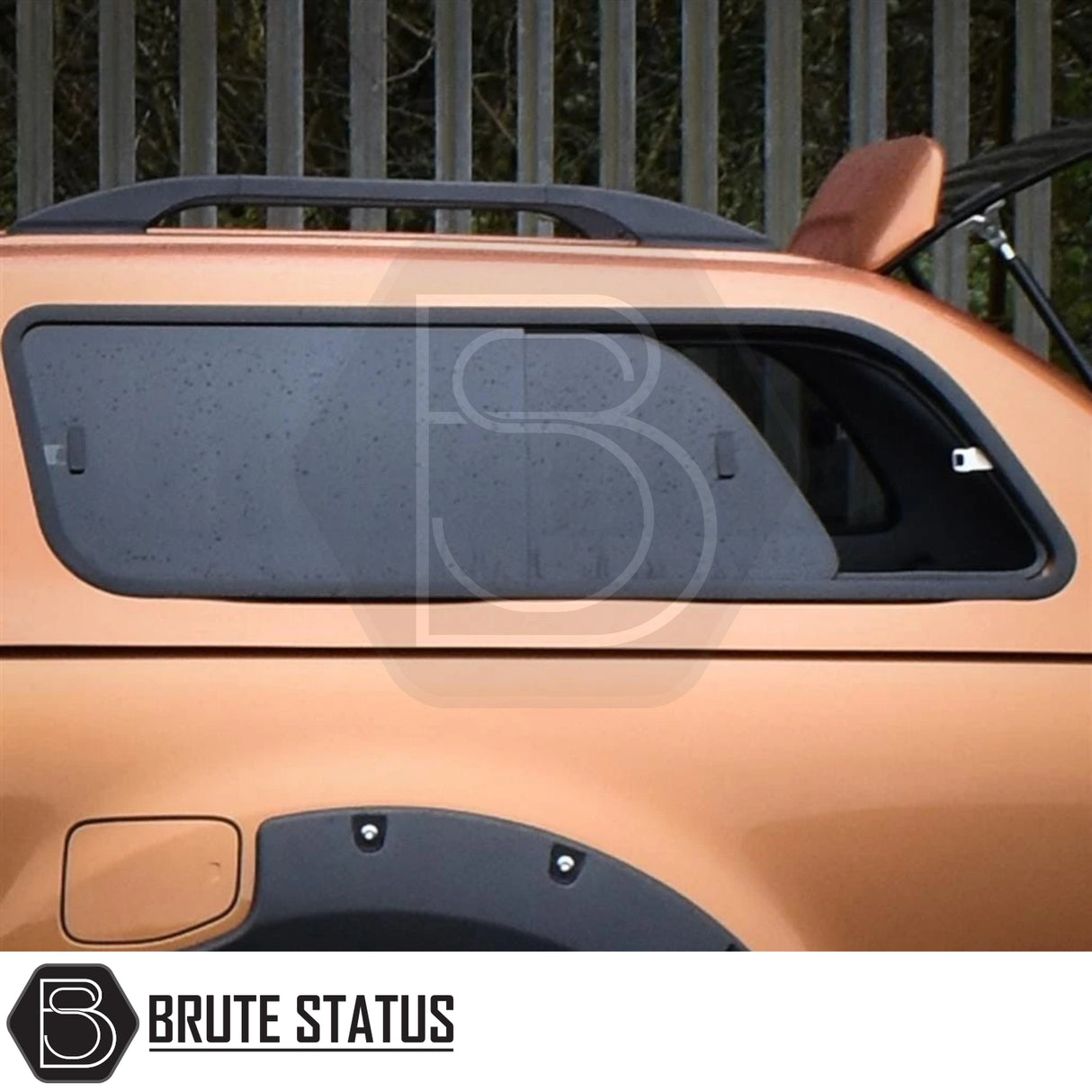 Close-up of Ford Ranger 2012-2022 Truckman GLS Hardtop Canopy, showcasing its side window, roof rails, and open rear hatch with Brute Status logo watermark.