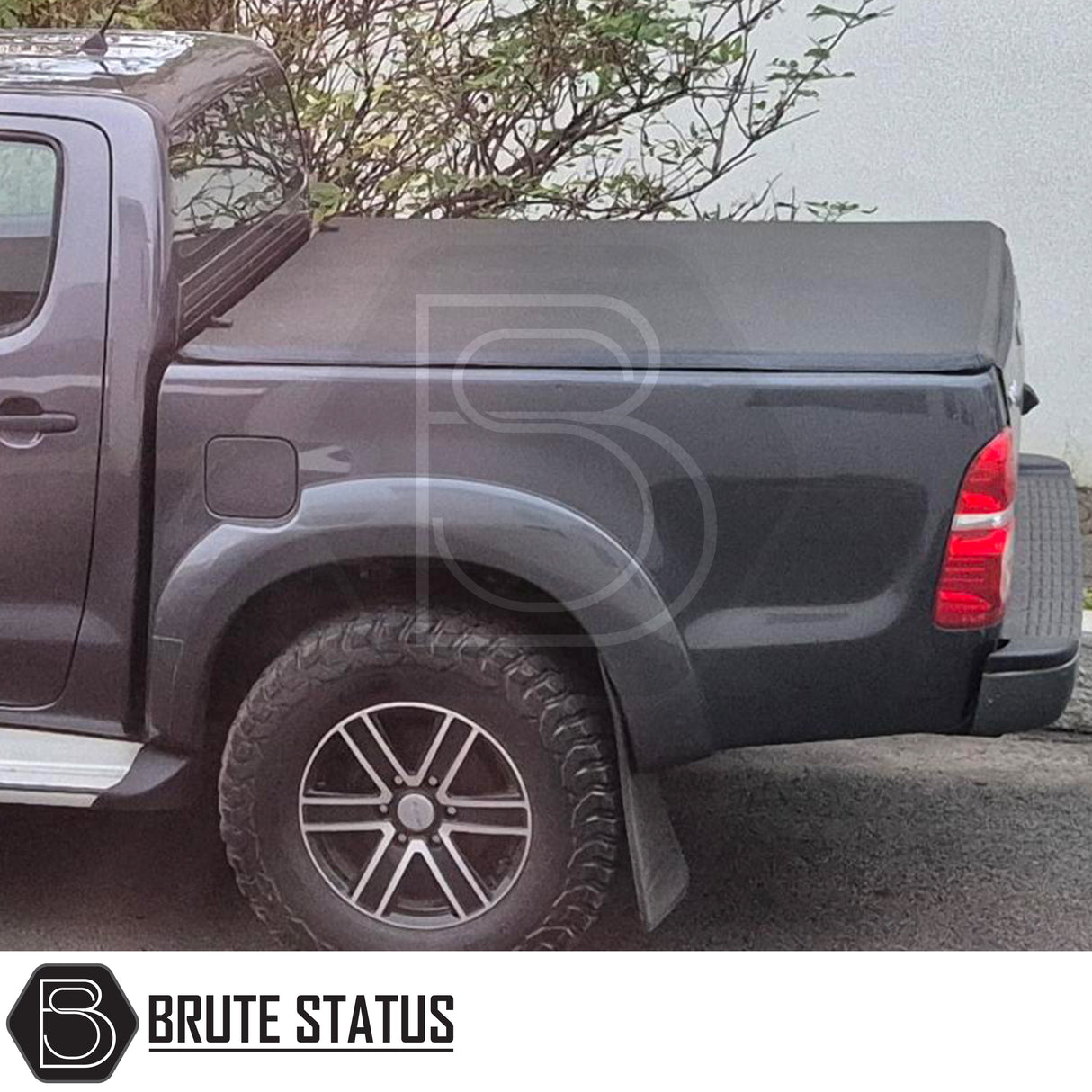 Tonneau Cover for Fiat Fullback 2015-2019 Double Cab with tri-fold design and durable UV-stable vinyl, featuring rubber seals and aluminium securing catch.