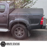 Tonneau Cover for Fiat Fullback 2015-2019 Double Cab with tri-fold design and durable UV-stable vinyl, featuring rubber seals and aluminium securing catch.