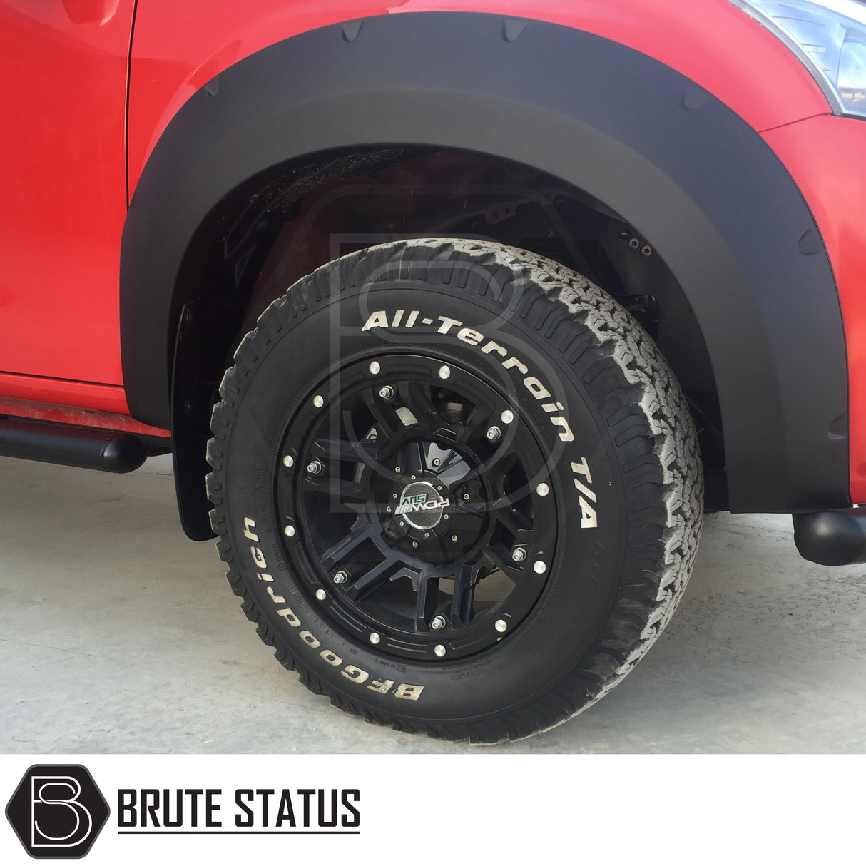 Wide arch kit fitted on Isuzu D-Max Double Cab (2012–2015 pre-facelift), featuring aggressive fender flares in matte black ABS plastic for off-road styling and enhanced stance.