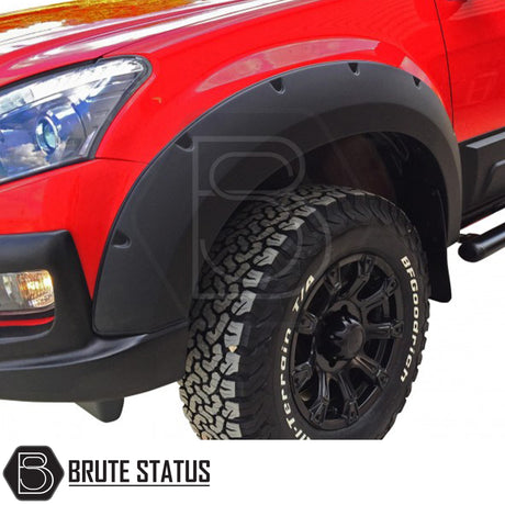 Wide arch kit fitted on Isuzu D-Max Double Cab (2012–2015 pre-facelift), featuring aggressive fender flares in matte black ABS plastic for off-road styling and enhanced stance.