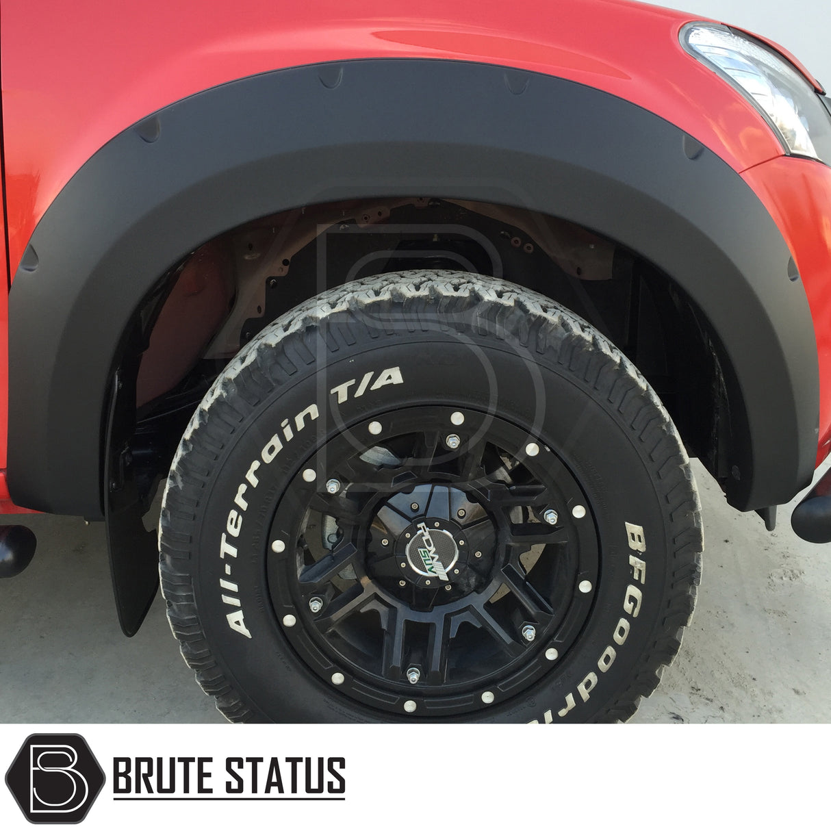 Wide arch kit fitted on Isuzu D-Max Double Cab (2012–2015 pre-facelift), featuring aggressive fender flares in matte black ABS plastic for off-road styling and enhanced stance.