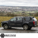 Isuzu D-Max 2012-2021 Truckman GLS Hardtop Canopy with remote locking and roof bars on a pickup, embodying ruggedness and luxury amidst a scenic landscape.