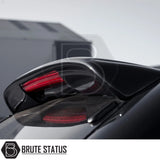 Close-up of a black sports car’s rear spoiler with glowing red LED light, showcasing the Isuzu D-Max 2012-2021 Truckman Grand Hardtop Canopy - Remote Locking.