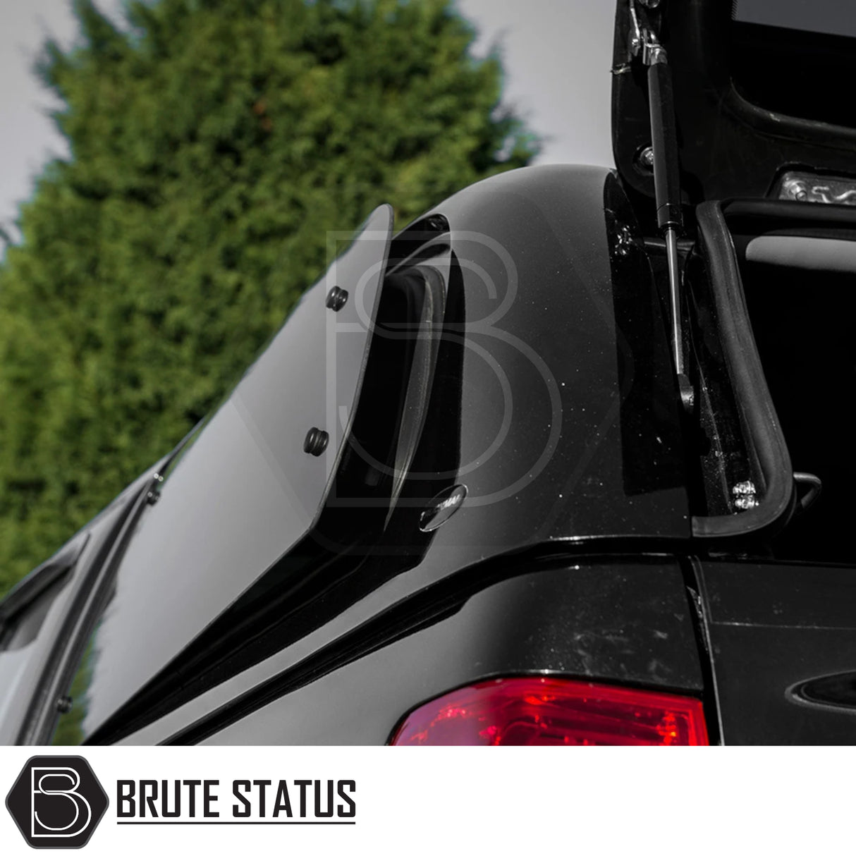 Brute Status branded Truckman Grand hardtop canopy for Isuzu D-Max, featuring pop-out side window on gas-strut hinges, showcasing premium design and functionality.