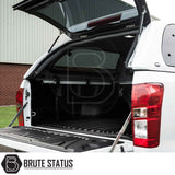 Rear view of an Isuzu D-Max 2012-2021 Truckman Grand Hardtop Canopy with remote locking, tailgate down, showcasing bed liner and canopy with Brute Status logo.