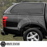 Isuzu D-Max 2012-2021 Truckman Grand Hardtop Canopy with remote locking, showcasing its sleek design and matching black fiberglass canopy on the rear-quarter of the pickup truck.