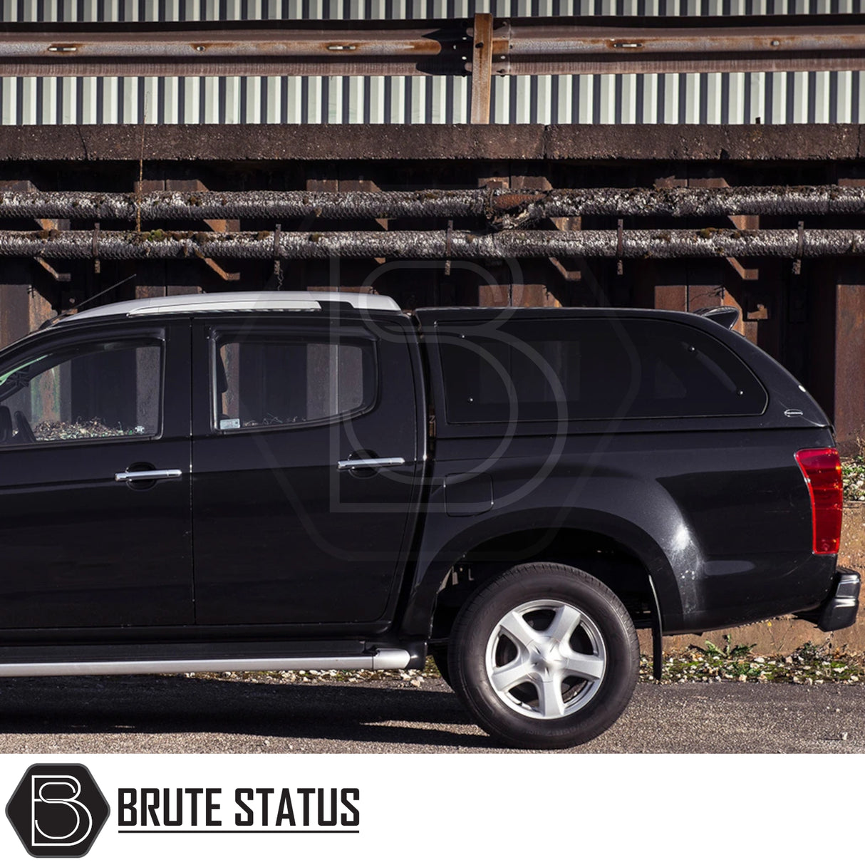 Isuzu D-Max 2012-2021 Truckman Grand Hardtop Canopy - Remote Locking, side profile view with industrial backdrop, highlighting premium features for enhanced storage and security.