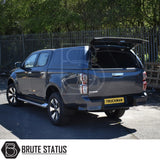 Isuzu D-Max 2012-2024 Truckman RS Hardtop Canopy with solid rear window and remote locking, parked with open hatch showcasing secure storage for commercial use.