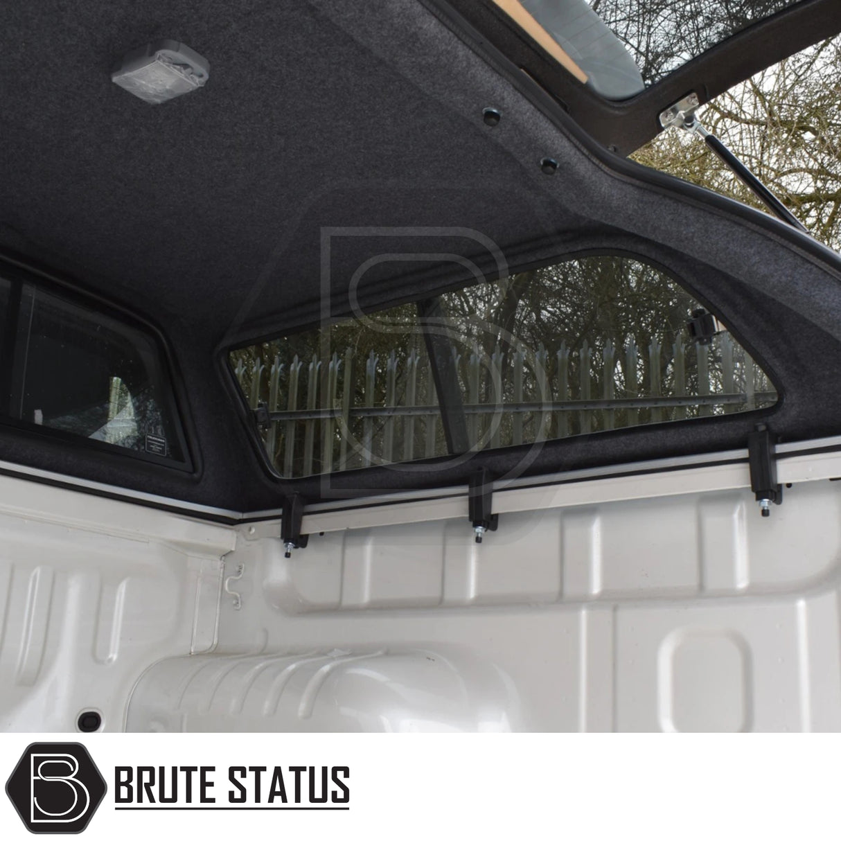 Isuzu D-Max Truckman GLS Hardtop Canopy with remote locking, featuring a carpet-lined interior, sliding tinted windows, and gas-strut-supported hatch in pickup bed.