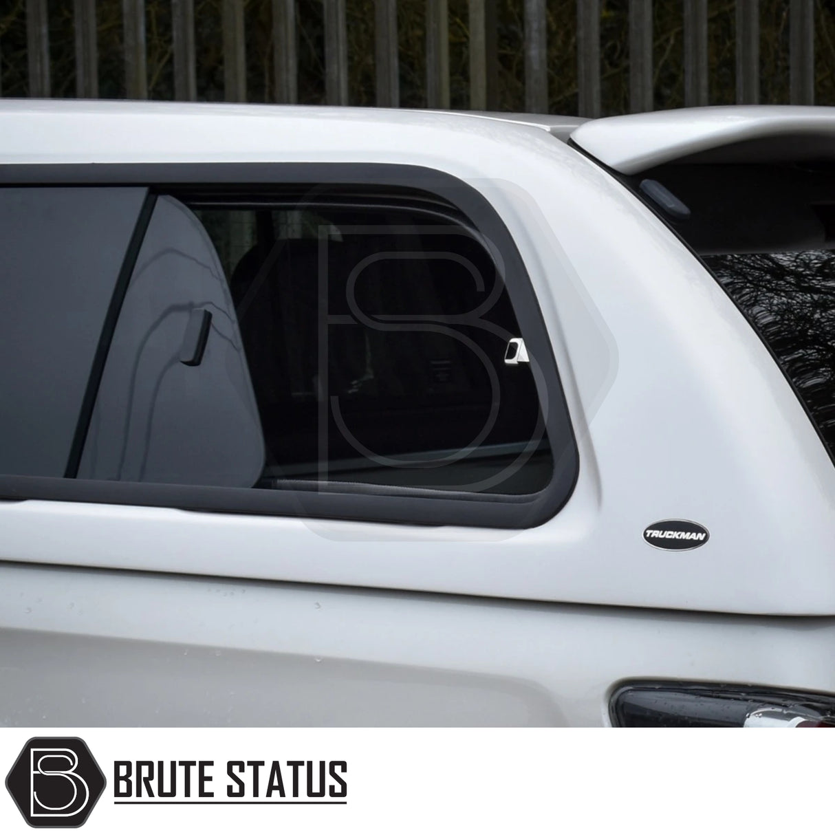 Isuzu D-Max Truckman GLS Hardtop Canopy with tinted sliding window, Truckman badge, and Brute Status logo watermark, showcasing luxury remote-locking canopy features.