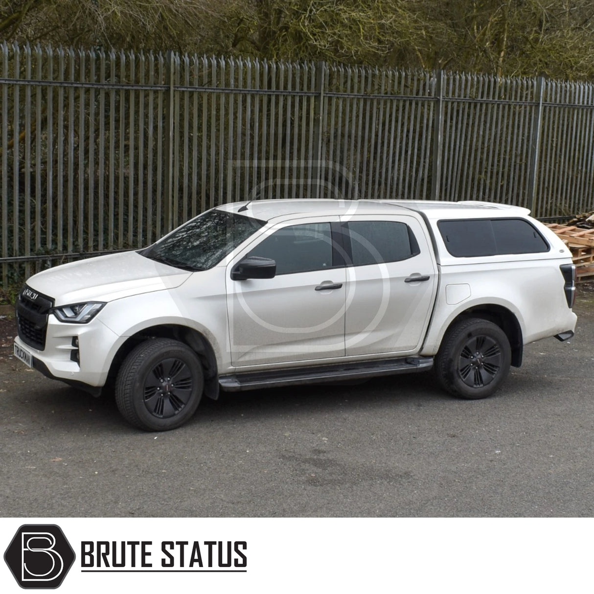Isuzu D-Max Truckman GLS Hardtop Canopy with remote locking, luxury features, and sporty design, parked alongside a metal fence, showcasing enhanced storage and security options.