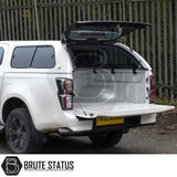 Rear view of an Isuzu D-Max  fitted with a Truckman GLS Hardtop Canopy, showcasing its open tailgate and glass-lift canopy for enhanced cargo access.