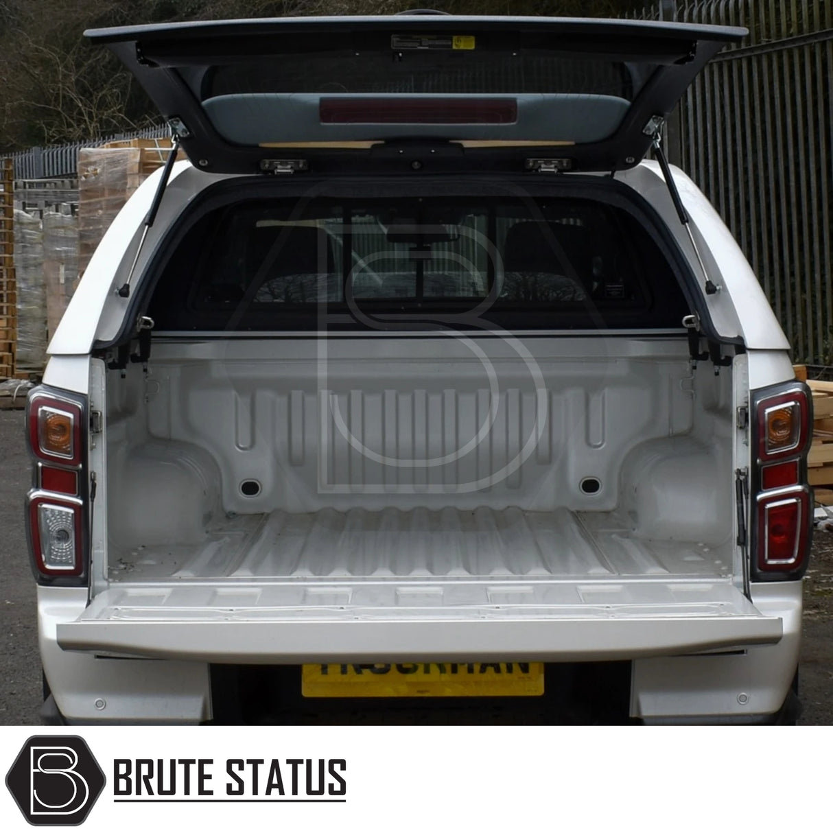 Isuzu D-Max  Truckman GLS Hardtop Canopy, featuring remote locking, open tailgate, and canopy rear window lifted for easy access to the empty bed.