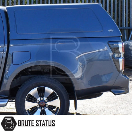 Isuzu D-Max 2025+ Truckman RS Hardtop Canopy with solid rear window and remote locking, featuring a color-matched fiberglass shell, alloy rim, and taillight detail.