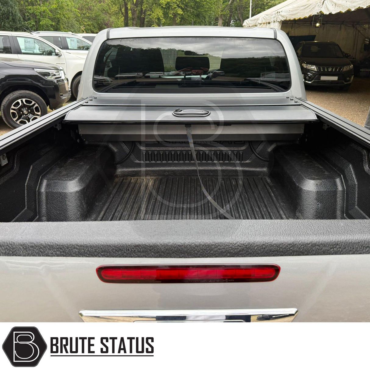 Black manual roller shutter for nissan navara np300 2015-2022 pickup truck. Durable, high-quality design for secure cargo protection and easy manual operation