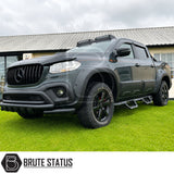 Heavy duty matte black powder coated carbon steel mounted side steps fitted to black Mercedes X-Class pickup truck offroad 4x4 vehicle. Including all mounting hardware for easy and straightforward installation. 