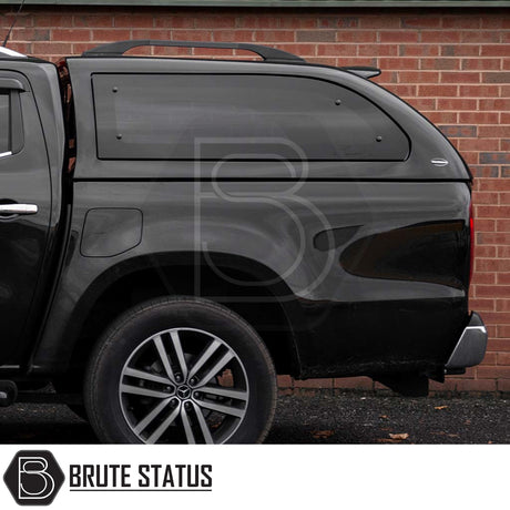 Rear view of Mercedes X-Class with Truckman Grand Canopy, featuring side window and roof rails, enhancing storage and security.