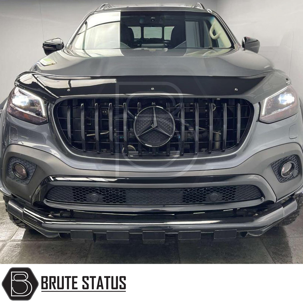 Angled front view of Mercedes X-Class with gloss black nudge bar enhancing aggressive styling