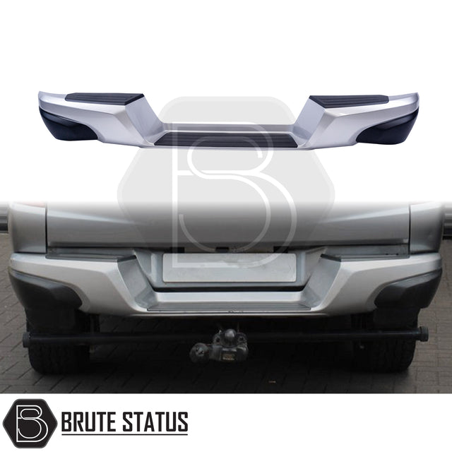 Silver rear bumper for 2015-2019 Mitsubishi L200, featuring a sleek factory-style finish, non-slip foot steps with drainage channels, and a durable, direct bolt-on design for easy installation and rugged use.