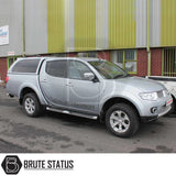 Mitsubishi L200 2010-2015 Series 4 Long Bed Truckman Grand Hardtop Canopy with remote locking, featuring tinted windows, roof rack, and chrome details on a parked double-cab pickup truck.