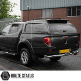 Mitsubishi L200 2010-2015 Long Bed Truckman L-Series Hardtop Canopy, showcasing rear view with alloy wheels and chrome bumper, highlighting secure and stylish storage.