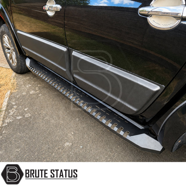 Matte Black heavy duty side panel protection fitted to Mitsubishi L200 Series 5 model pickup truck offroad 4x4 vehicle. Suitable for overlanding set ups, mounting hardware and brackets included. 