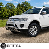Front mounting heavy duty carbon steel chrome silver nudge bull bar fitted to white Mitsubishi L200 Series 5 pickup truck, offroad 4x4 vehicle. Suitable for overlanding set ups. 