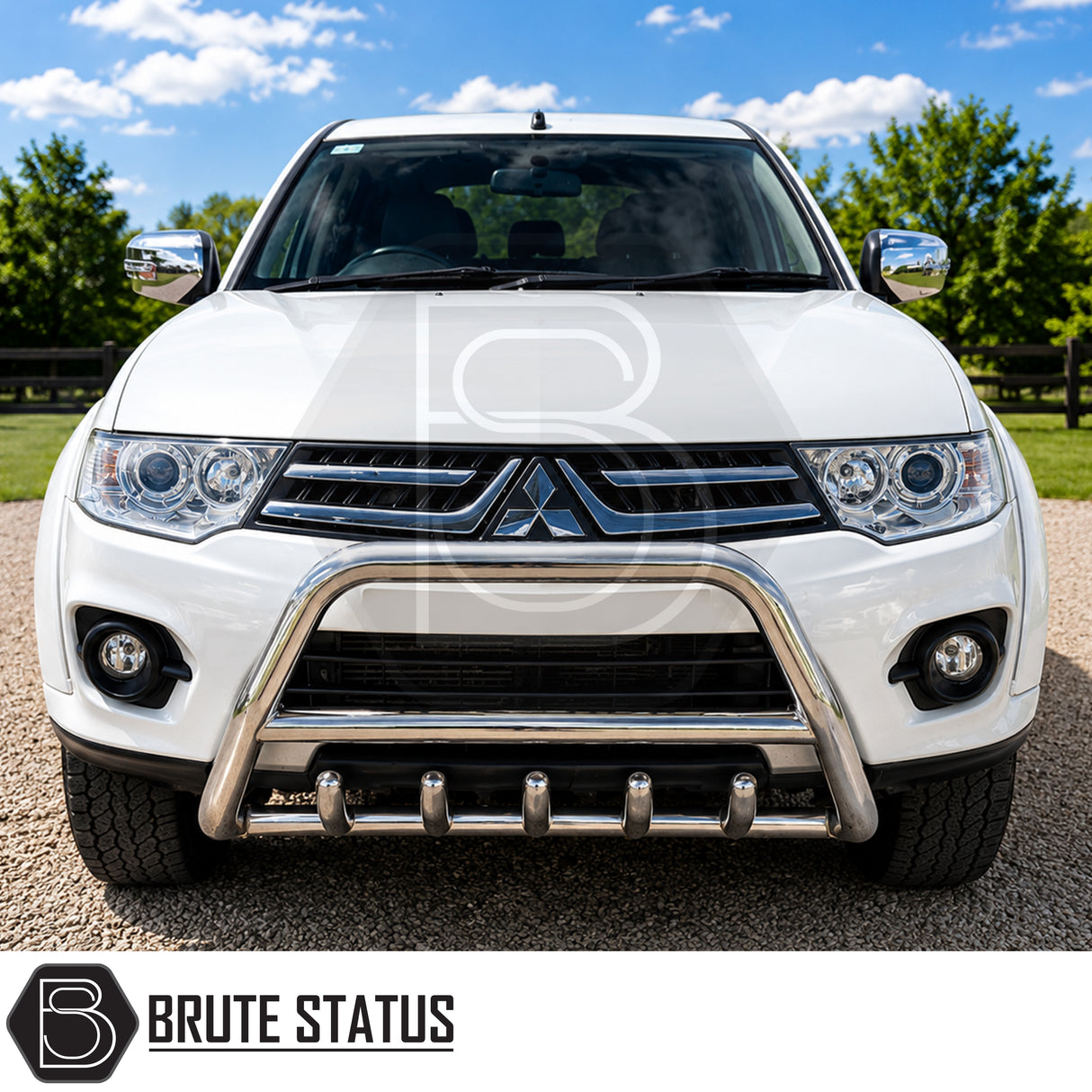 Front mounted fitted chrome stainless carbon steel bull bar to a white Mitsubishi L200 pickup truck offroad 4x4 vehicle. Suitable for overlanding set ups. 