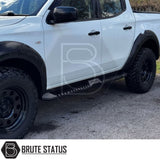 Mitsubishi L200 Series 5 2015-2019 Heavy Duty S32 Steel Side Steps in matt black, shown installed on a parked vehicle, highlighting durability and design.