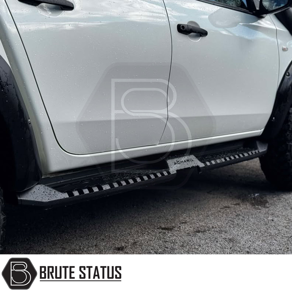 Mitsubishi L200 Series 5 2015-2019 Heavy Duty S32 Steel Side Steps in matt black, shown installed on a parked vehicle, highlighting durability and design.