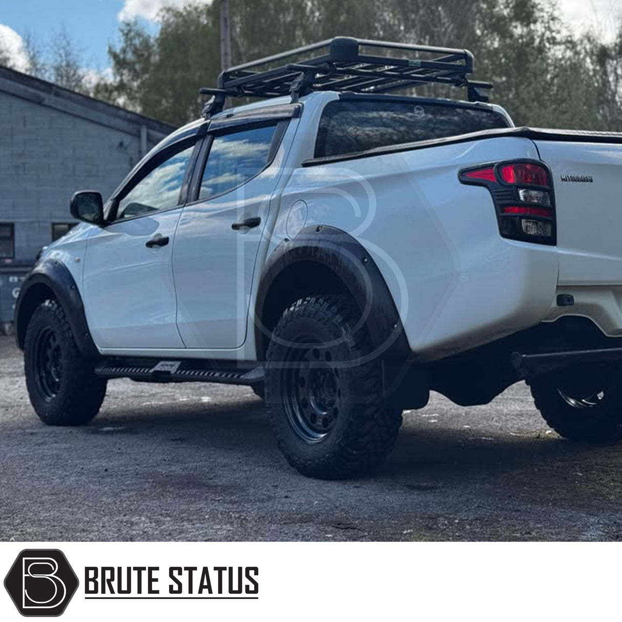 Mitsubishi L200 Series 5 2015-2019 Heavy Duty S32 Steel Side Steps in matt black, shown installed on a parked vehicle, highlighting durability and design.