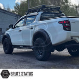 Mitsubishi L200 Series 5 2015-2019 Heavy Duty S32 Steel Side Steps in matt black, shown installed on a parked vehicle, highlighting durability and design.