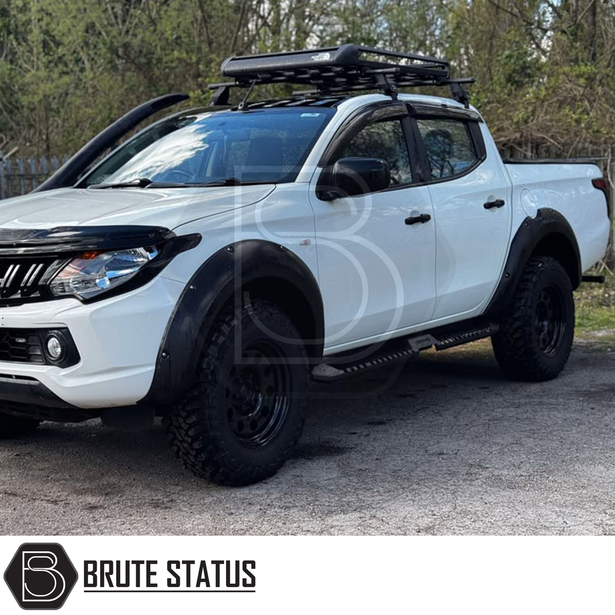 Mitsubishi L200 Series 5 2015-2019 Heavy Duty S32 Steel Side Steps in matt black, shown installed on a parked vehicle, highlighting durability and design.
