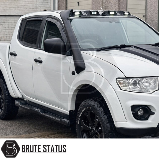 Heavy-duty UV-resistant LLDPE snorkel kit for Mitsubishi L200 MK4 (2006–2014), featuring eagle-style intake head, mounting hardware, brackets, intake pipes, stainless steel clamps and installation template.