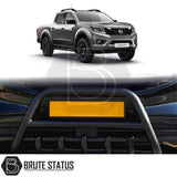 Matte black city bar fitted to a 2006–2015 Nissan Navara D40, manufactured from durable carbon steel to enhance styling and provide bumper protection, with a TÜV-certified, no-drill, DIY installation using chassis-mounted U-brackets.