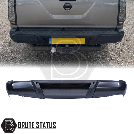 Black rear bumper for Nissan Navara NP300 (2015–2022), featuring a sleek factory-style finish, pre-drilled holes for OEM parking sensors, non-slip foot steps with drainage channels, and a durable, direct bolt-on design for easy installation and rugged use