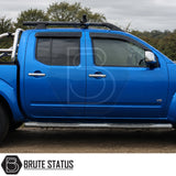 Front and rear wind rain deflectors fitted onto Blue Nissan Navara D40 pickup truck suitable for off roading and overlanding set ups. 