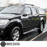 Nissan Navara 2005-2015 D40 Truckman Grand Hardtop Canopy with remote locking, featuring a sleek design, roof racks, side-step bars, alloy wheels, and all-terrain tires.