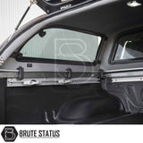Nissan Navara 2005-2015 D40 Truckman Grand Hardtop Canopy with load-securing system, featuring black bed liner, tie-down rails, and adjustable anchors.
