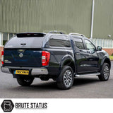 Nissan Navara 2005-2015 D40 Truckman Grand Hardtop Canopy with remote locking, featuring a stylish design, pop-out tinted windows, and enhanced storage, parked outside.
