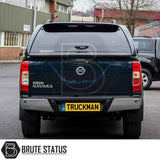Nissan Navara 2005-2015 D40 fitted with Truckman Grand Hardtop Canopy showcasing remote locking and pop-out windows for enhanced security and style.